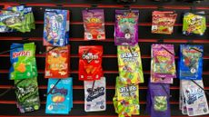 A wall of delta-8 snacks at a smoke shop