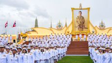 Government officials ranged in front of a portrait of King Maha Vajiralongkorn outside the Grand Palace in Bangkok during celebrations to mark his 72nd birthday in July