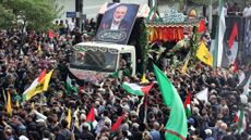 Iranians take part in a funeral procession for late Hamas leader Ismail Haniyeh, in Tehran, ahead of his burial in Qatar